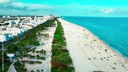 South Pointe Beach in South Beach Miami FL drone view flying right over the sand with views of the Atlantic Ocean. photo