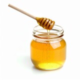 Glass jar of honey with dipper isolated on white background