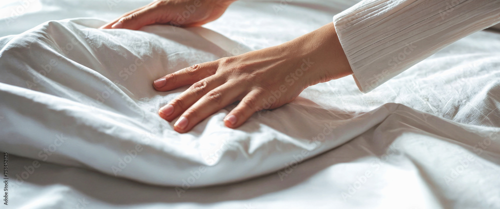 Obraz premium Woman cleaning lady making a bed in a hotel. Panorama.