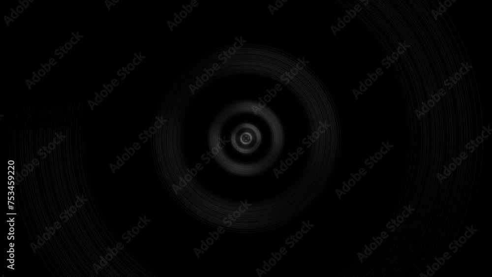 Radiating rings in white on black background. Abstract background or design element. Radiating rings in white on black background. Abstract background or design element.