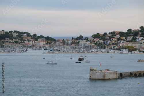 Panoramic scenic coastal landscape view of Toulon, France city skyline romantic Saint Mandrier sur Mer peninsula bay from departing cruiseship cruise ship liner during summer Med cruising