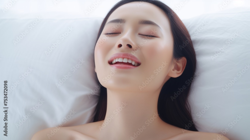 A beautiful asian female is enjoying and feels good. Woman's face during an orgasm in bed. Women's pleasure. A beautiful asian female is enjoying and feels good. Woman's face during an orgasm in bed. Women's pleasure.