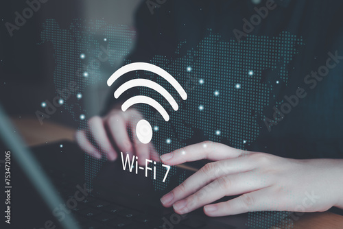 Person using computer laptop with Wi-Fi 7. New Wi-Fi technology version 7, Communication, High-speed internet connection concept background.