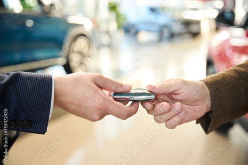 Buyer takes the car keys from the car seller