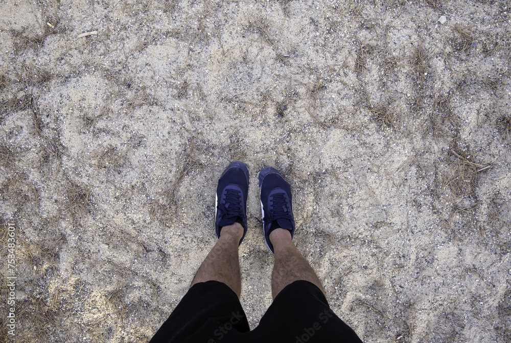 Fototapeta premium Man's feet in the sand
