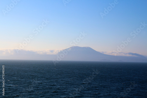 Alaska-The volcano Mount Edgecumbe rises from the coastal fog in the background 