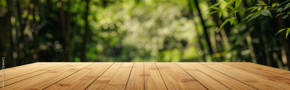 Empty wooden table over blurred bamboo background. banner, panorama, mock up for design and product display. Empty wooden table over blurred bamboo background. banner, panorama, mock up for design and product display.
