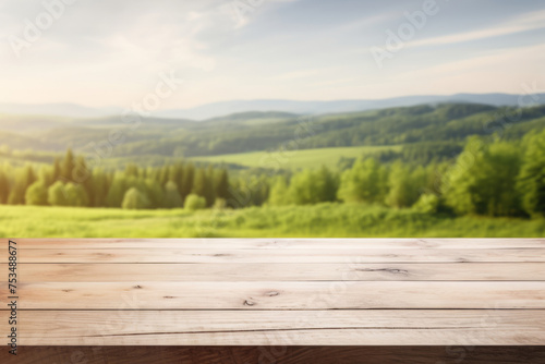 an empty wooden table on a blurred background of the countryside. a mockup for the display of your product. © MaskaRad