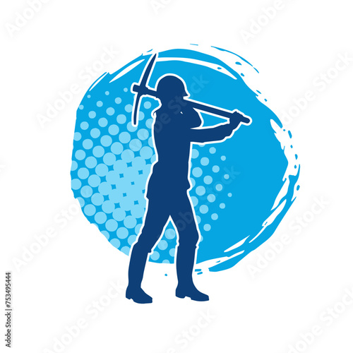 Silhouette of a woman in worker costume carrying pick axe tool in action pose. Silhouette of a female miner in action pose with pick axe tool.