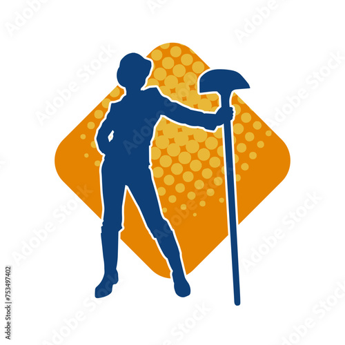 Silhouette of a female wearing worker costume in action pose with shovel tool.