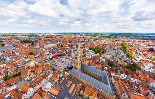 Bruges, Belgium. Belfort. City center. Residential areas. Panorama of the city. Summer day, cloudy weather. Aerial view
