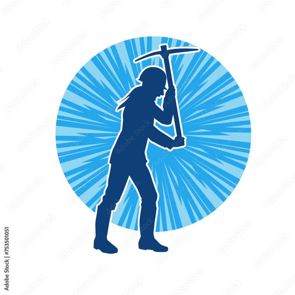 Obraz premium Silhouette of a woman in worker costume carrying pick axe tool in action pose. Silhouette of a female miner in action pose with pick axe tool.