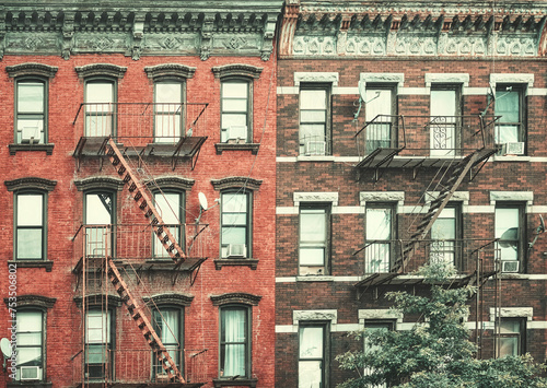 Old buildings with fire escapes, color toning applied, New York City, USA.