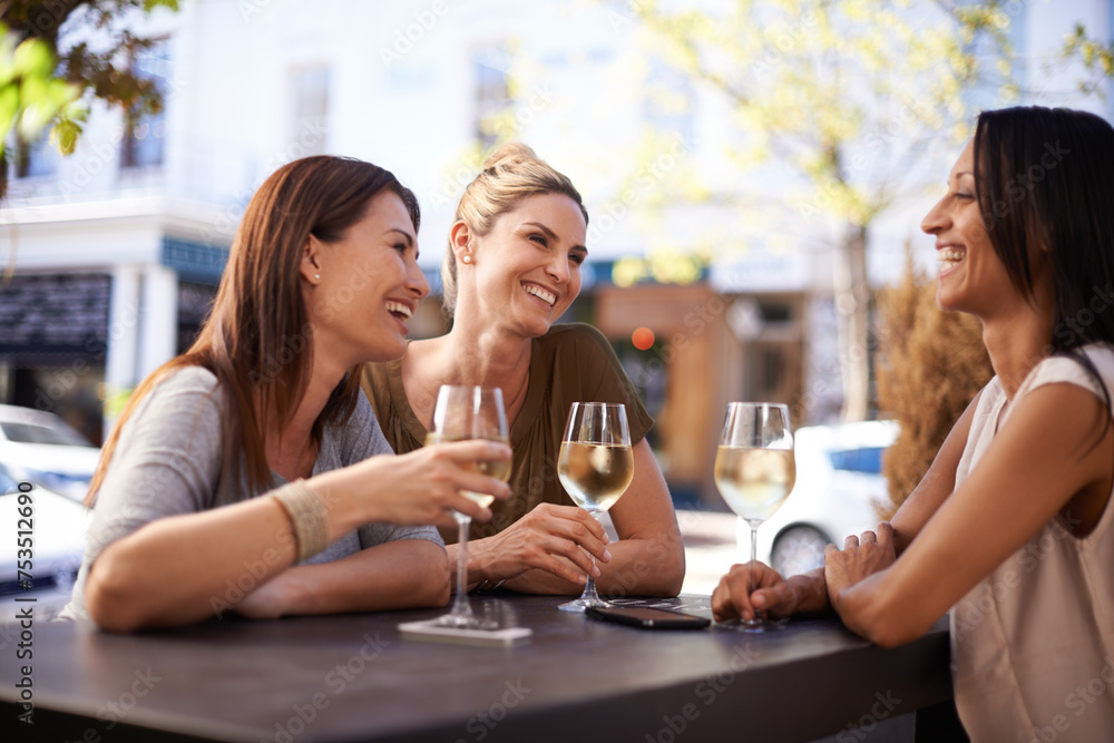 Friends, wine and women drinking at restaurant with laughing, bonding and relax outdoor in city for celebration. People, happy and alcohol at cafe for social gathering, funny gossip or fun at reunion