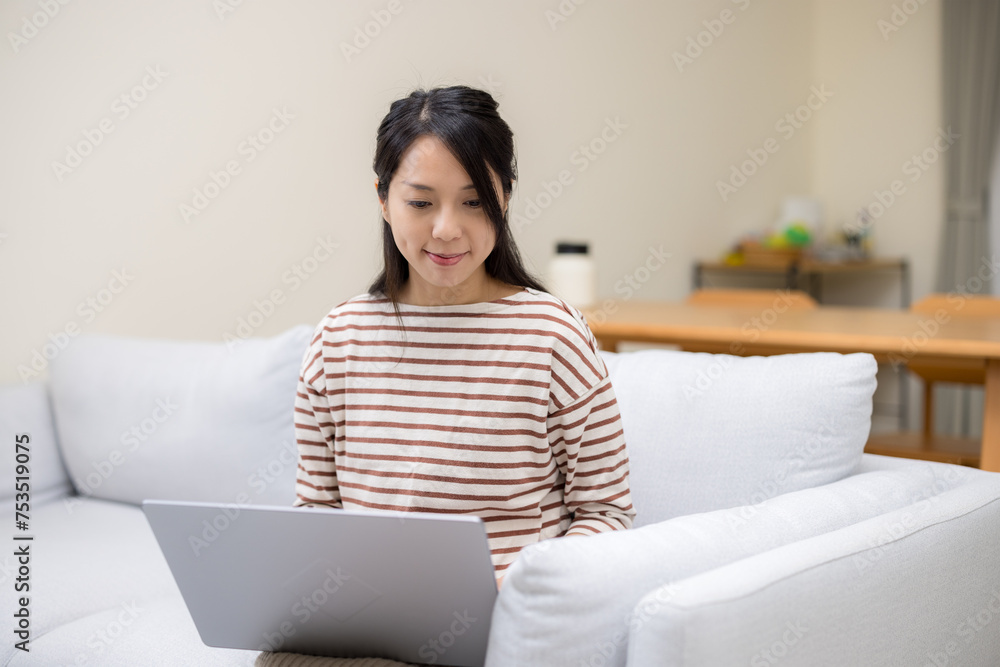 Woman work on notebook computer at home Woman work on notebook computer at home