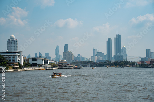 Cruise on the Chao Phraya River and cityscape of Bangkok. © YANGYANG