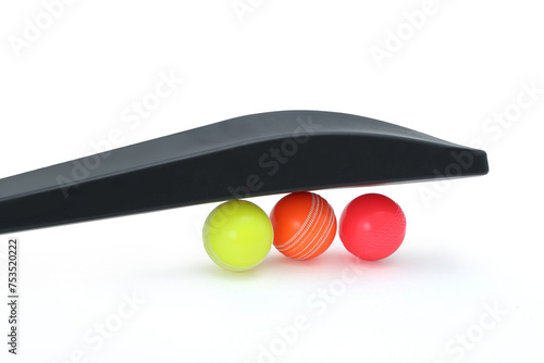 wind ball with black pvc cricket bat isolated  photo