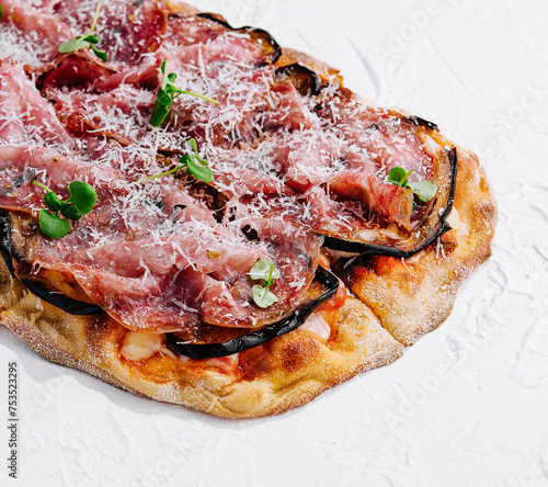 pizza with prosciutto parma ham with parmesan cheese photo