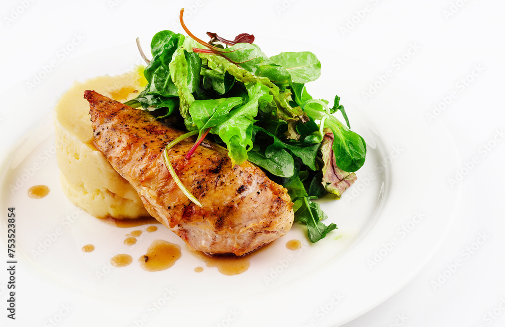 Baked chicken breast with mashed potatoes and arugula