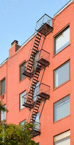 Residential building with fire escape, New York City, USA.