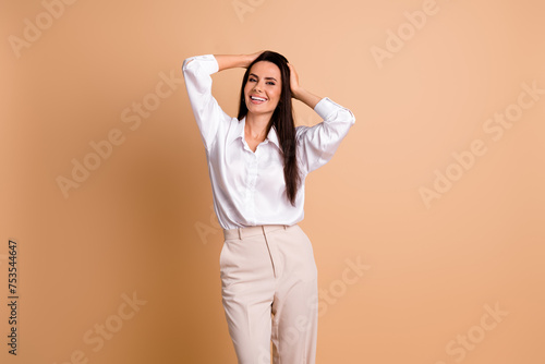 Photo of positive lovely person arms touch head self love acceptance empty space isolated on beige color background