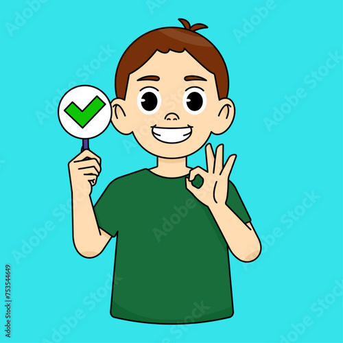 Boy smiling and holding a green check mark sign and showing ok gesture. Consent sign