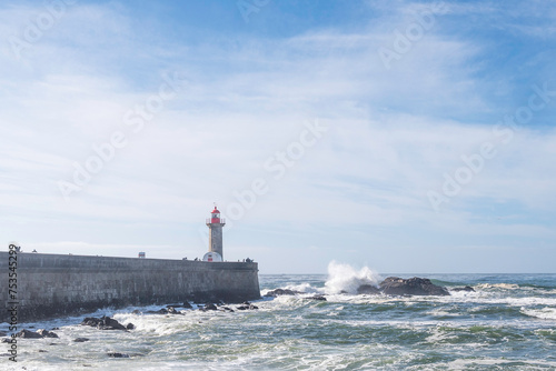 The Felgueiras Lighthouse at Douro river mouth in Foz do Douro near Porto, on a bright sunny day © parkerspics