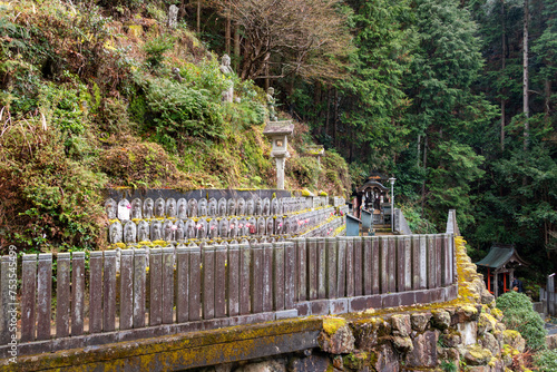 Jizo statue on a way to Tanukidanisan Fudoin temple in Kyoto, Japan photo