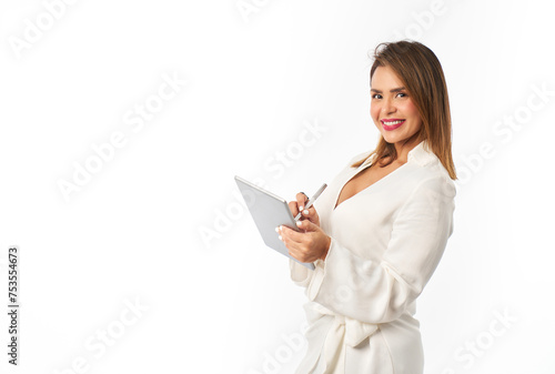 smiling latina woman working with pen on digital tablet isolated on white background