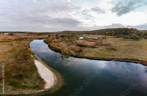 Aerial panorama on river curve in autumn valley