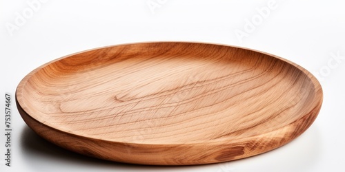 Wooden plate on white background, no contents, angled view