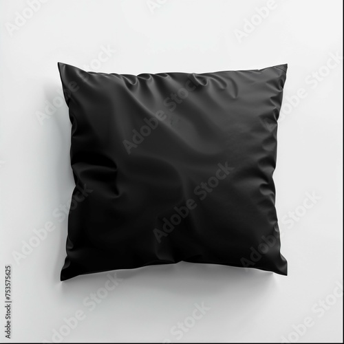 A sleek black square pillow is featured prominently against a stark white background. The pillow displays a smooth satin-like material with a subtle sheen, giving it a luxurious appearance. 