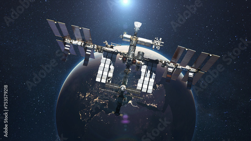 Fototapeta Naklejka Na Ścianę i Meble -  The ISS flies on the background of the blue planet Earth with the light of the sun. Space mission and space exploration