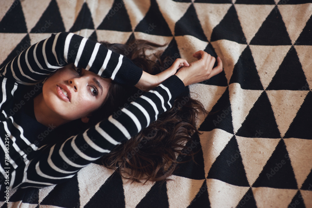 Woman, lying and carpet for thinking of fashion, stylish and clothing as minimalist aesthetic. Edgy, female person or planning of texture, pattern and design as contemporary fabric or textile idea Woman, lying and carpet for thinking of fashion, stylish and clothing as minimalist aesthetic. Edgy, female person or planning of texture, pattern and design as contemporary fabric or textile idea