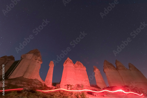 Cappadocia fairy chimneys with blue sky during the day and stars at night