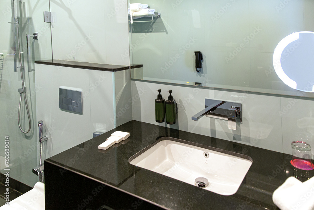 Fototapeta premium Modern bathroom interior with illuminated mirrors