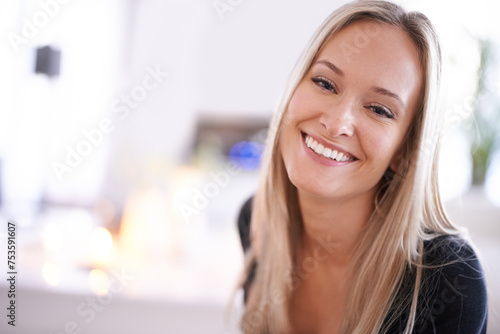 Happy, portrait and woman relax in a house with positive attitude, confidence or feel good mood. Smile, face or female person in living room with peace, calm or resting on weekend or vacation at home