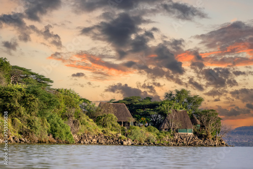 Kenya - Naviasha lake. It is a freshwater lake outside the town of Naivasha in Nakuru County, north-west of Nairobi. Lake cruise by boat. Settlements around the lake. photo