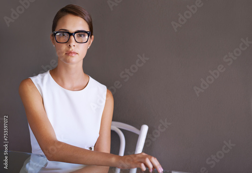 Tableau sur toile Model, serious and portrait in glasses in studio, vision and trendy frame eyewear for optometry