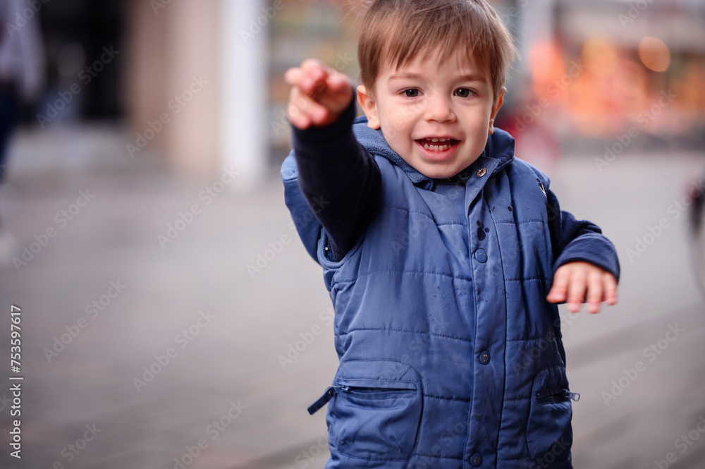 A joyful toddler reaches out to the world around him, his face alight with excitement and the infectious enthusiasm of childhood A joyful toddler reaches out to the world around him, his face alight with excitement and the infectious enthusiasm of childhood