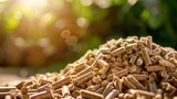 Biomass wood pellets and woodpile stack with copy space on blurred background for text placement