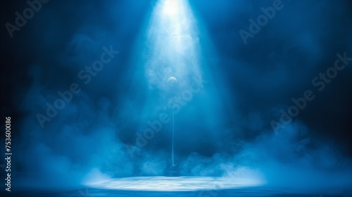 Spotlights illuminate free empty stage blue background.