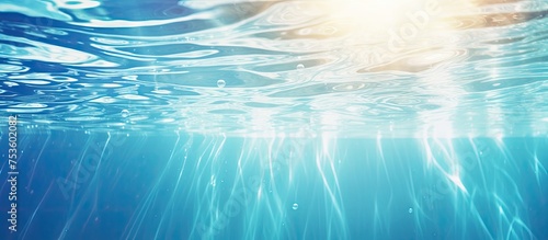 Tranquil Underwater Scene with Sunlight Filtering Through Azure Water Surface