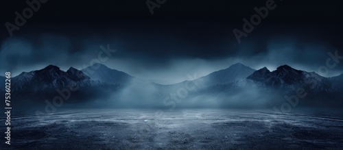 Majestic Dark Mountain Landscape under Foreboding Sky in Wilderness photo