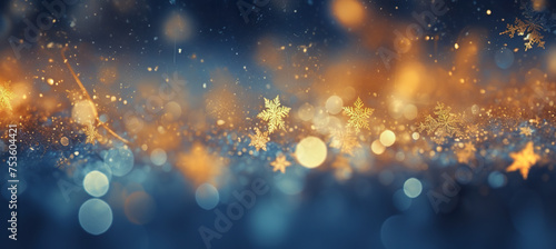 Cozy Christmas golden snowflakes on the snow background with yellow and blue bokeh hues. Festive, uplifting wallpaper backdrop