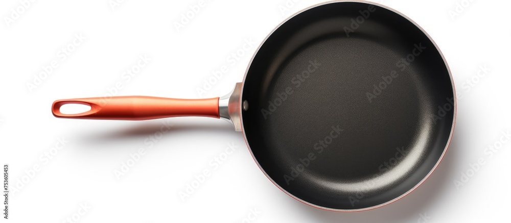 Sleek Black Cookware: A Kitchen Essential with a Bold Orange Accent Handle Sleek Black Cookware: A Kitchen Essential with a Bold Orange Accent Handle