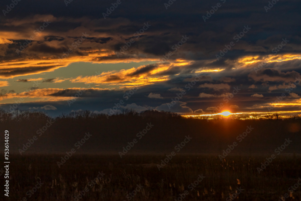 Sunset over the marsh creates a beautiful cloudscape Sunset over the marsh creates a beautiful cloudscape