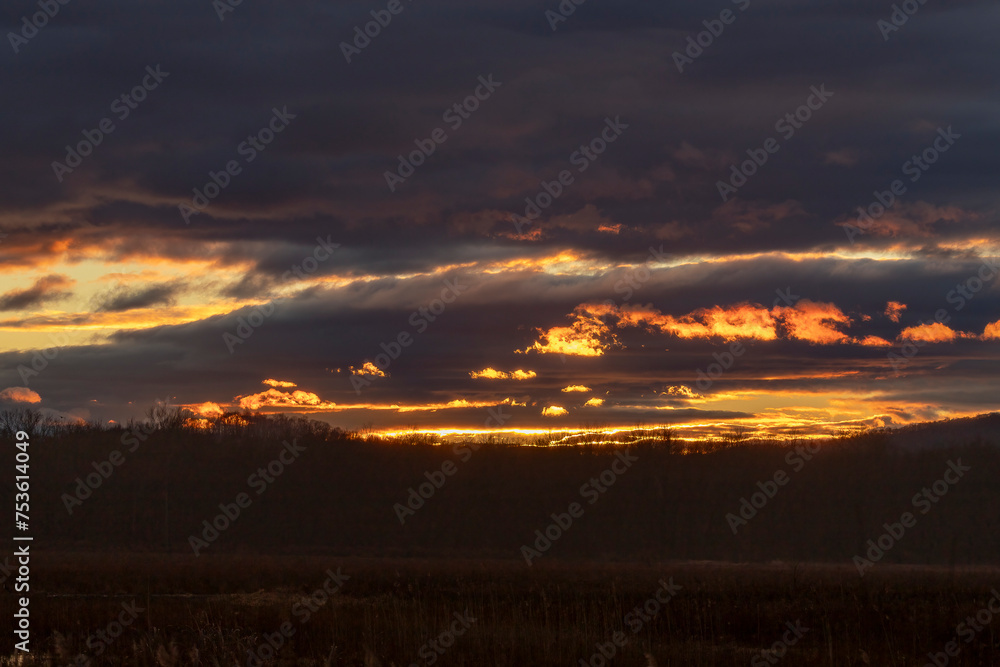 Sunset over the marsh creates a beautiful cloudscape