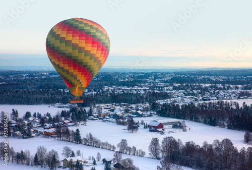 Colorful hotair balloon flying over Norwegian villages - Oslo, Norway