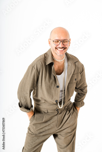 Cheerful bald male in glasses with hands in pockets © Galdric